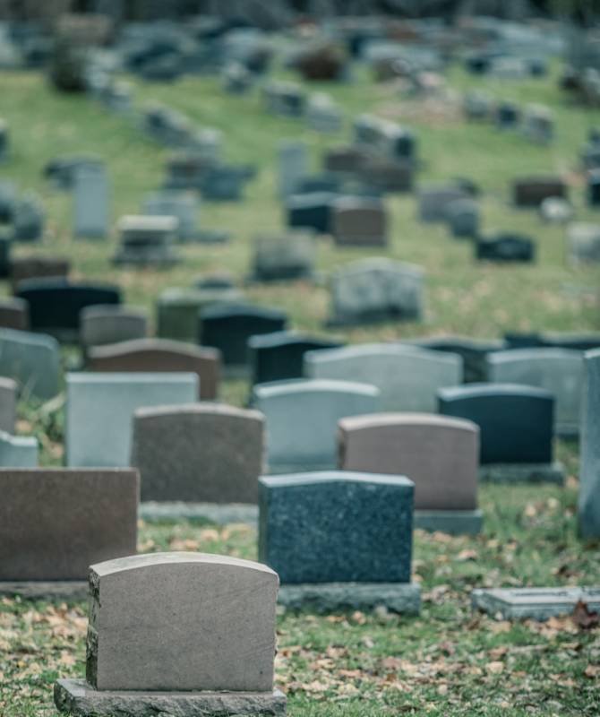 Back of Gravestones in a Old Cemetery in Autumn